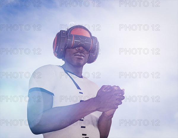 Strong man wearing virtual reality helmet