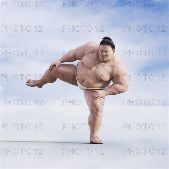 Sumo wrestler standing on one leg