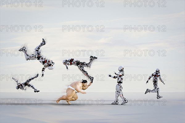 Sumo wrestler running and toppling robots