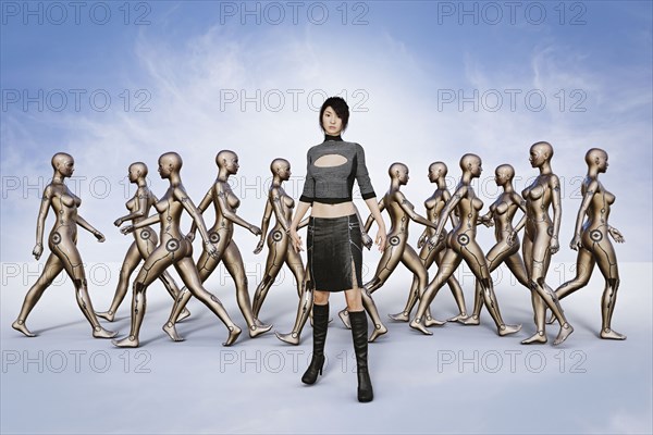 Portrait of woman standing in front of walking robots