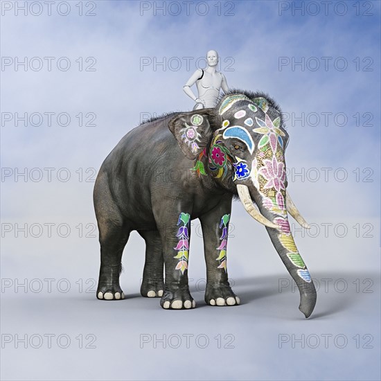 Robot man riding painted elephant