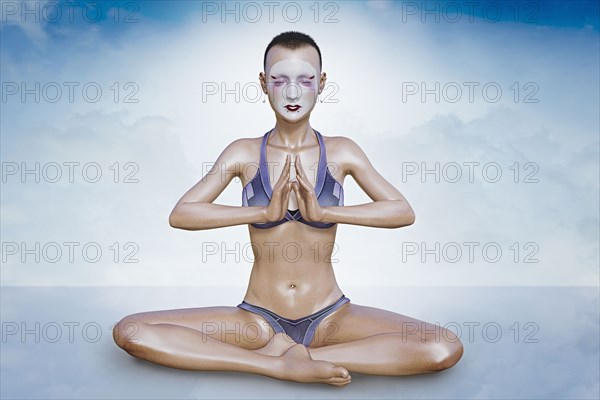 Woman wearing face paint meditating