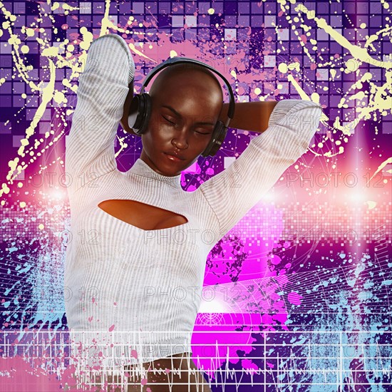 Woman listening and dancing to headphones