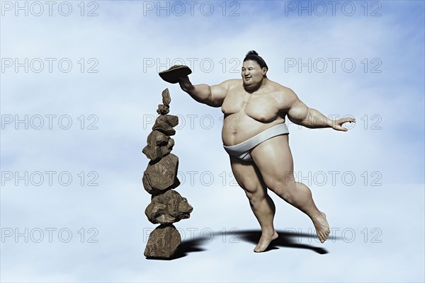 Sumo wrestler balancing pile of rocks