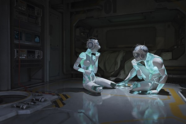 Cyborgs sitting on floor wearing virtual reality helmets