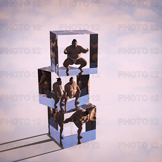Stack of sumo wrestlers frozen in suspended animation