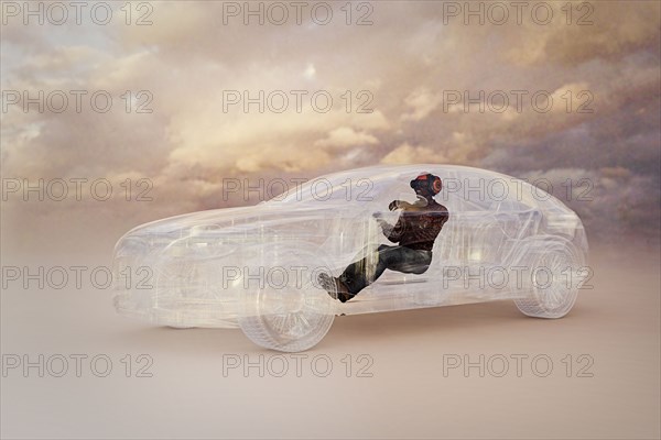 Man wearing virtual reality helmet driving car