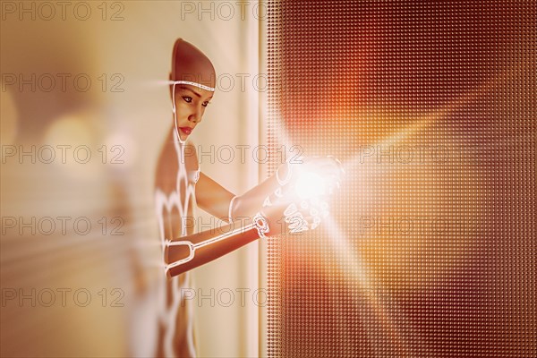 Light glowing in hands of futuristic woman emerging from wall