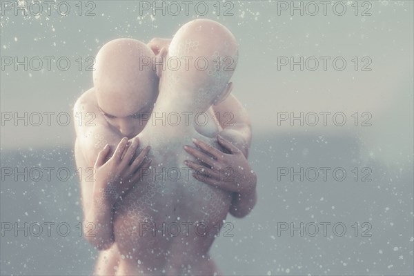 Bubbles floating near futuristic hugging woman