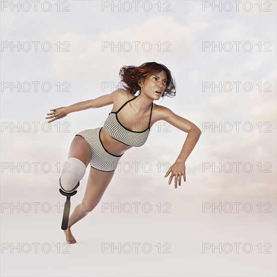 Woman running with artificial leg