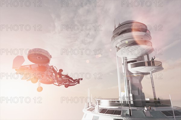 Man in futuristic tower waving to flying vehicle