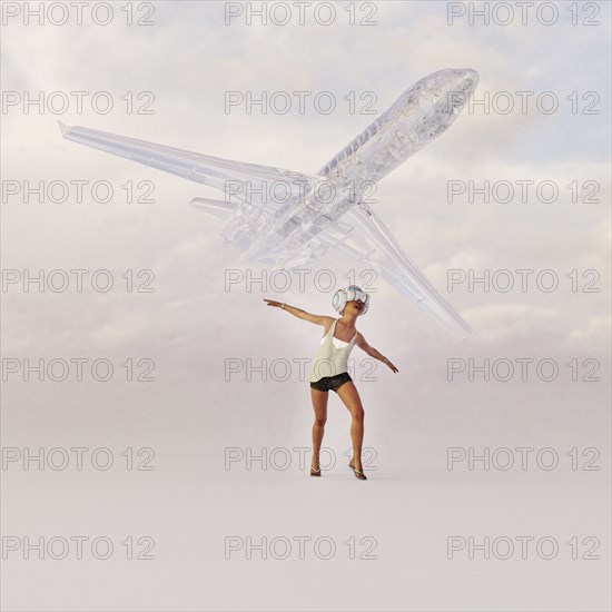 Girl wearing virtual reality goggles imitating airplane