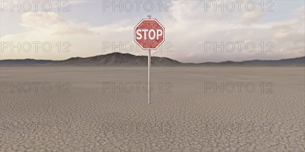 Stop sign in barren desert