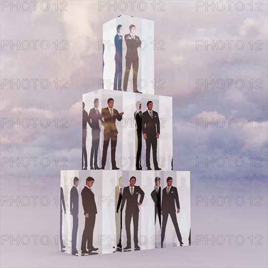 Stack of cubes with businessmen trapped inside