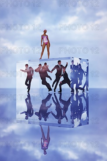 Robot woman standing on cube with businessmen trapped inside