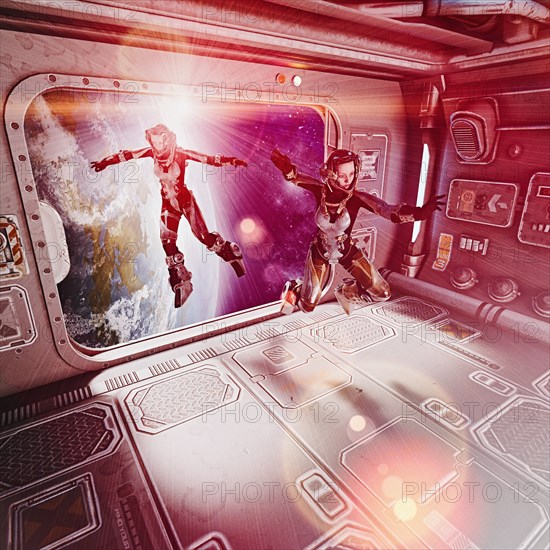 Women floating in space suits inside spaceship