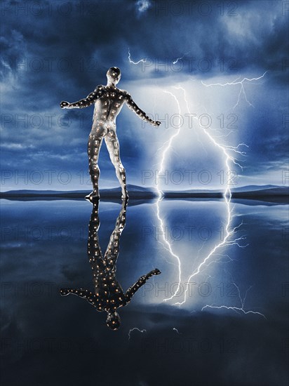 Reflection of glowing man watching lightning