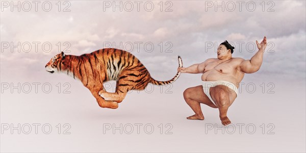 Sumo wrestler holding tiger by the tail