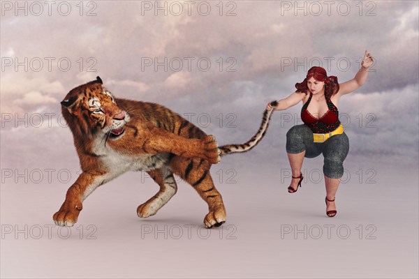 Woman holding a tiger by the tail
