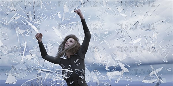 Shards of glass falling on woman