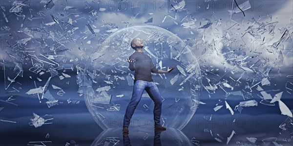 Man standing in sphere protected from falling shards of glass