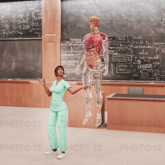 Teacher looking at organs of transparent hologram man