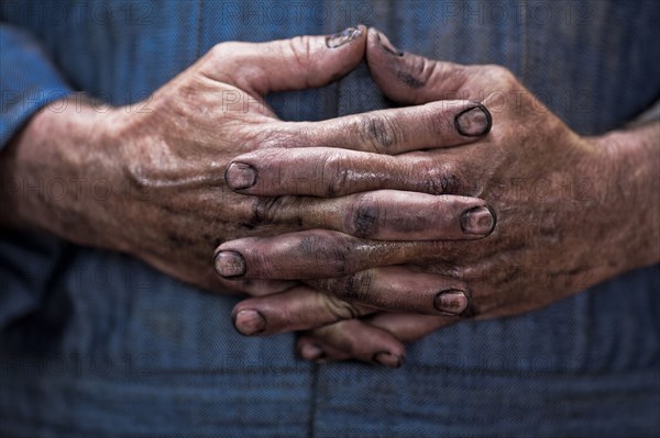 Close up of Caucasian mechanic's dirty hands