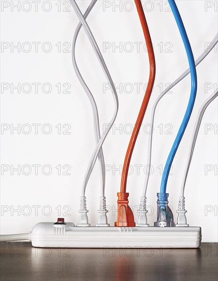 Close up of cords plugged into power strip