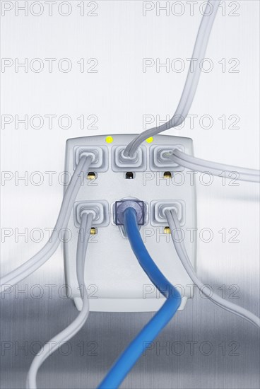 Close up of cords plugged into power strip