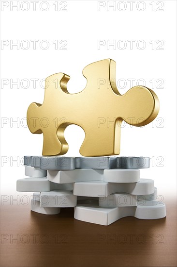 Close up of gold piece of jigsaw puzzle