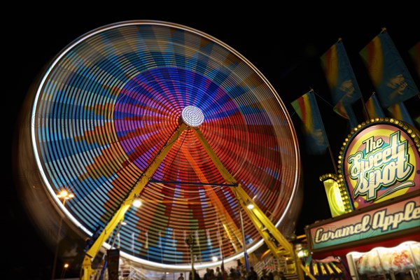 Blurred view of ferris wheel at amusement park