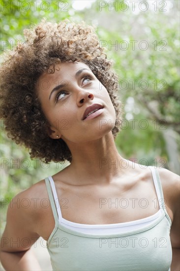 Mixed race woman looking up