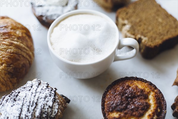 Close up of variety of pastries and coffee