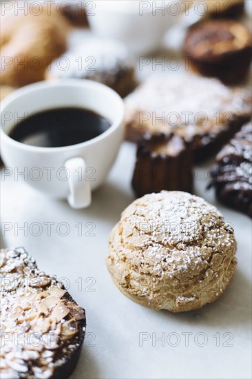 Close up of variety of pastries and coffee