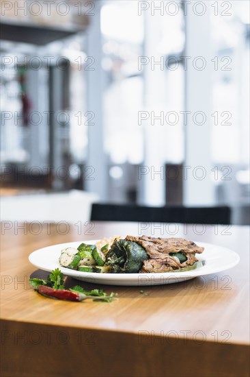 Plate of grilled pepper with vegetables and rice