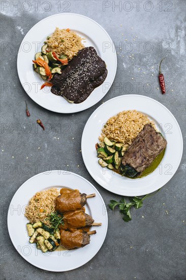 Plates of food with vegetables and rice