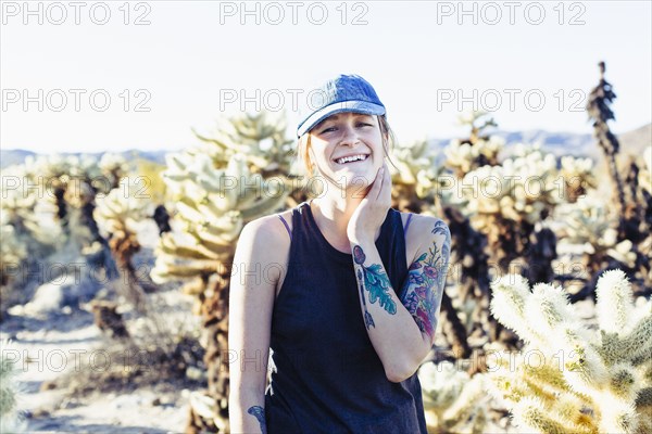 Caucasian woman smiling in desert field