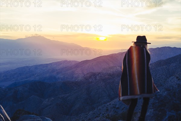 Caucasian woman overlooking remote desert landscape