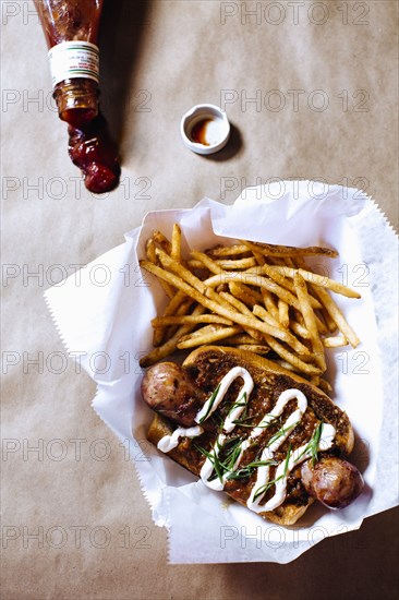 High angle view of chili dog with french fries