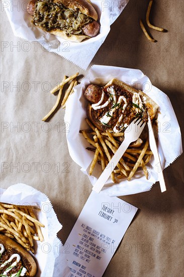 High angle view of chili dog with french fries