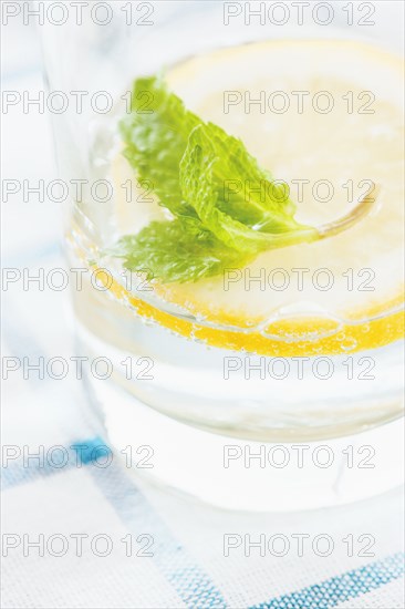 Close up of glass of herbal lemon water