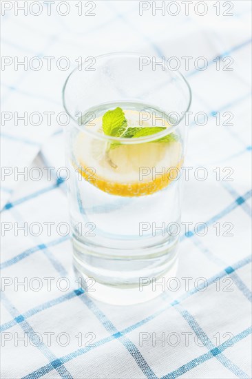 Close up of glass of herbal lemon water