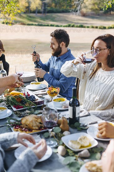 Friends eating at outdoor table