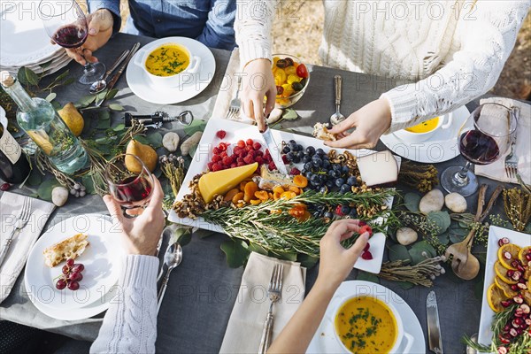 Friends eating at outdoor table