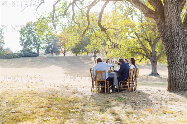 Friends eating at outdoor table