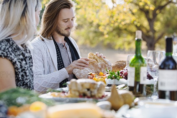 Couple eating at outdoor table