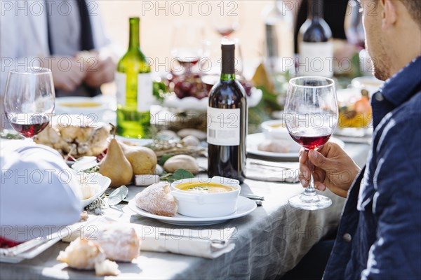 Friends eating at outdoor table