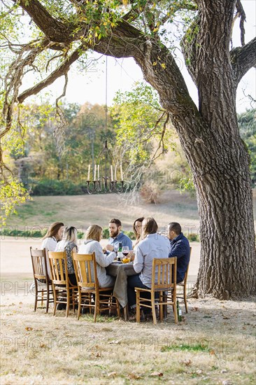 Friends eating at outdoor table