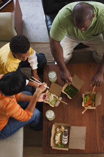 Family eating take-out Asian food