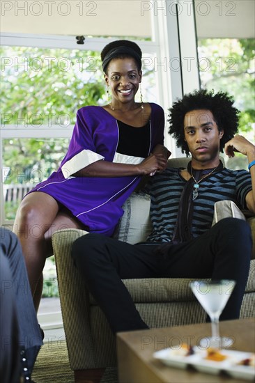 African American woman at cocktail party with boyfriend